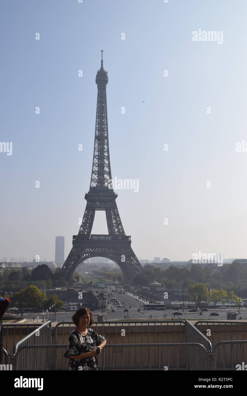 Senior citizen taken an iconic view with the Eiffel Tower in the background from the terrace at Trocadero Paris, France Stock Photo