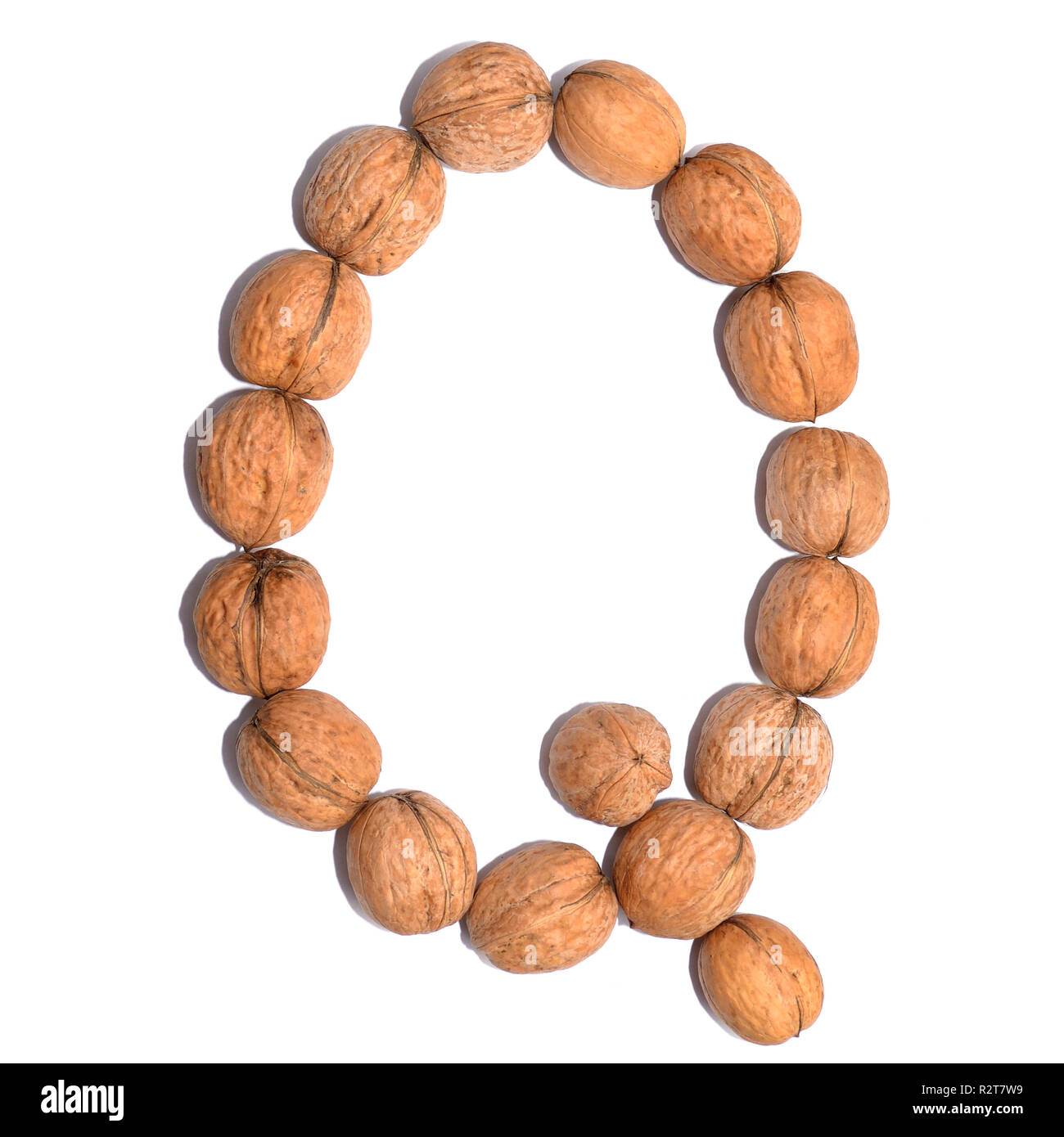 Letter Q made with nuts to form a letter of the alphabet. Fruit letters
