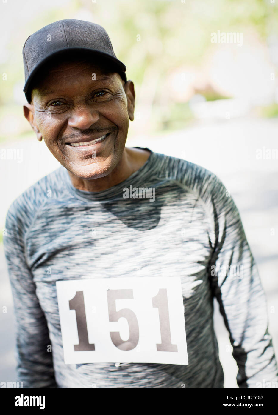 Portrait smiling, confident active senior man wearing sports race bib Stock Photo