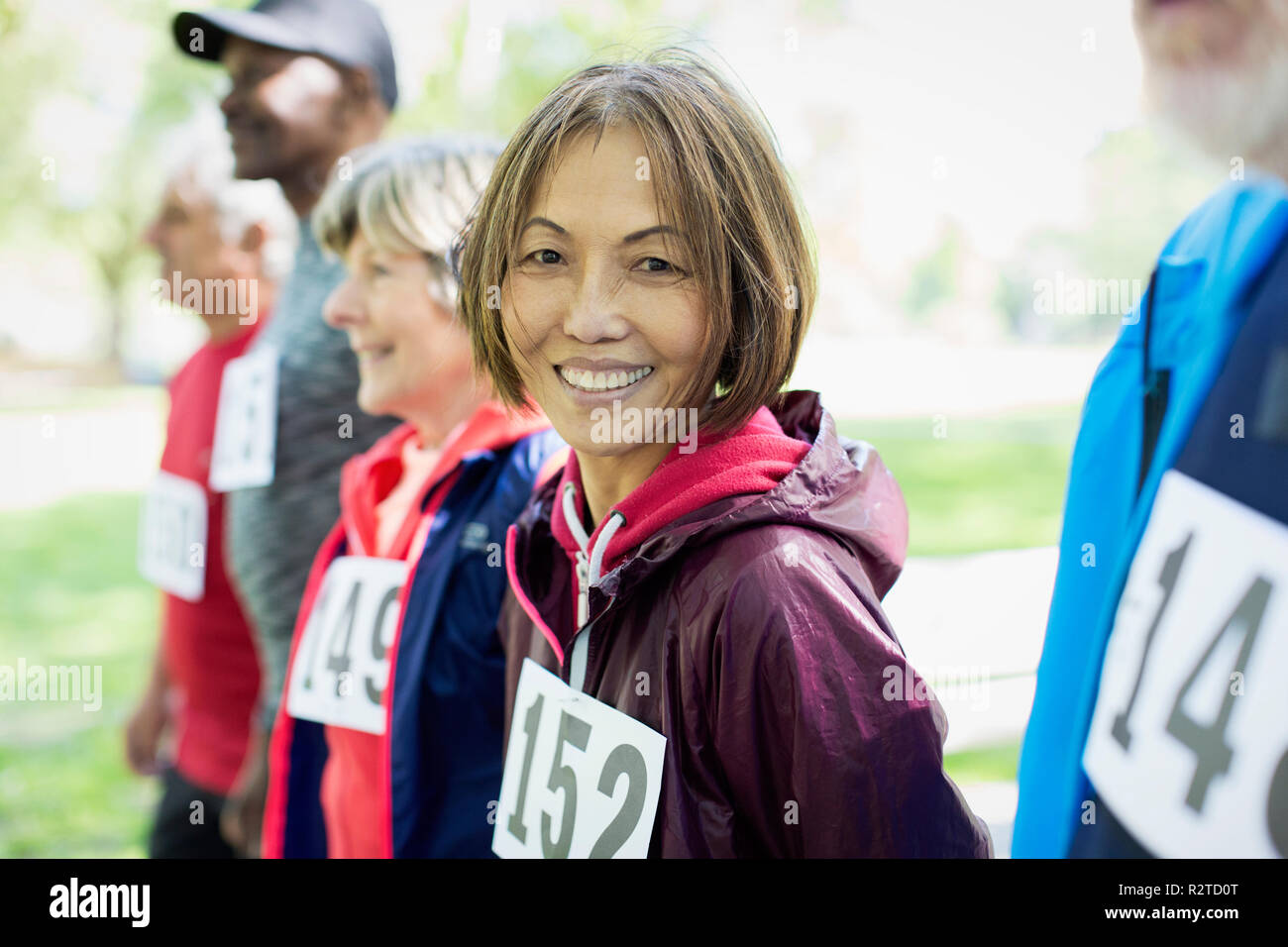 Portrait smiling, confident active senior woman at sports race starting line Stock Photo