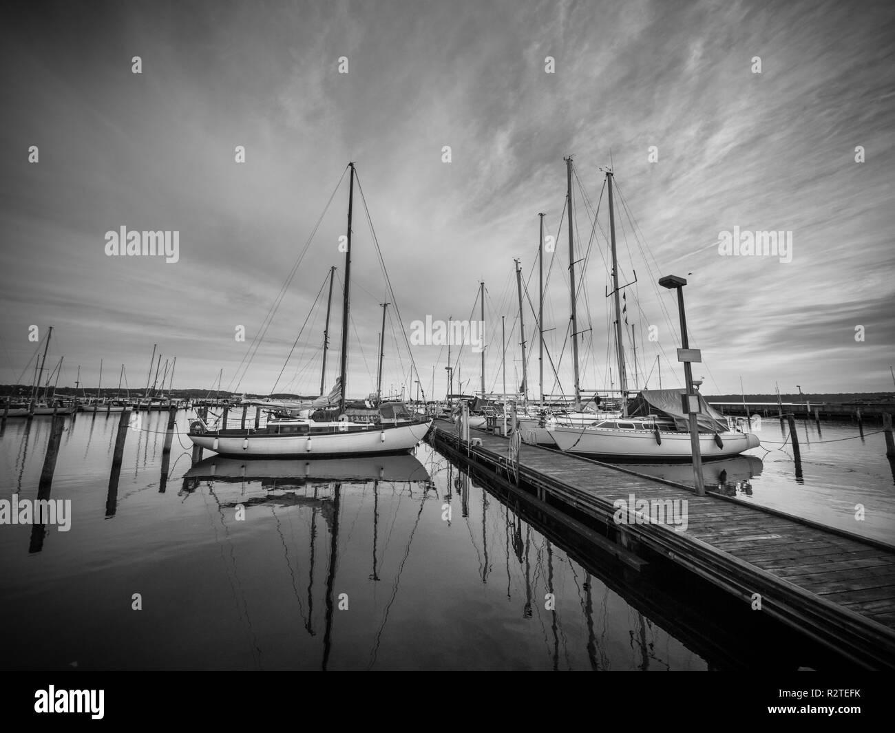 Image of a marina with water reflection and dramatic sky Stock Photo ...