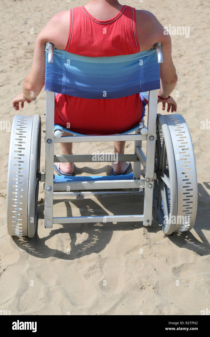 disabled man on a special wheelchair to go to the beach Stock Photo - Alamy
