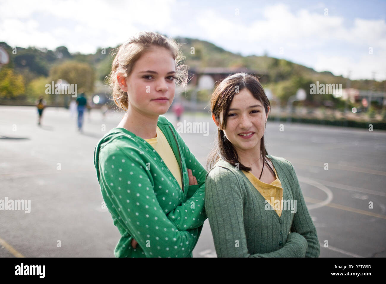 Portrait of two teenage girls in the school yard Stock Photo - Alamy