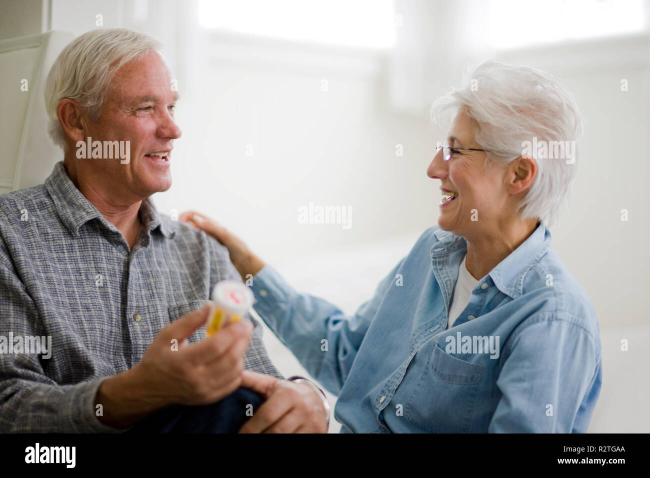 Two men holding up bottles hi-res stock photography and images - Alamy