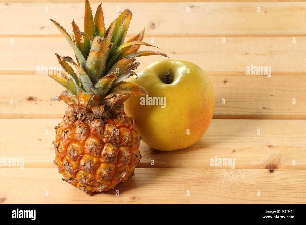 Pineapple and apple are the best buddies Stock Photo