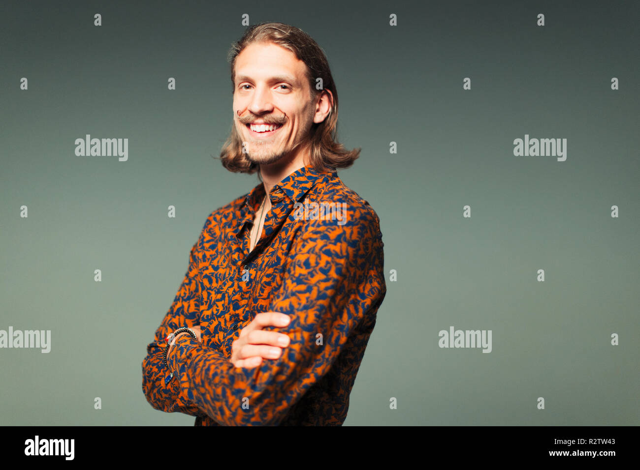 Portrait confident young man with handlebar mustache Stock Photo