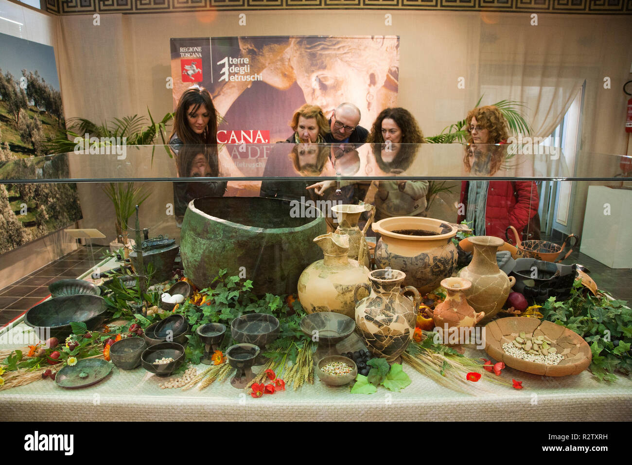 europe, italy, tuscany, vetulonia, archaeological museum, exibition, etruscan food, table laden with pots and utensils for banquet Stock Photo