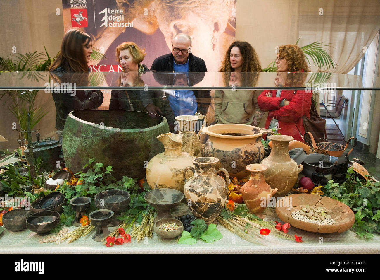 europe, italy, tuscany, vetulonia, archaeological museum, exibition, etruscan food, table laden with pots and utensils for banquet Stock Photo