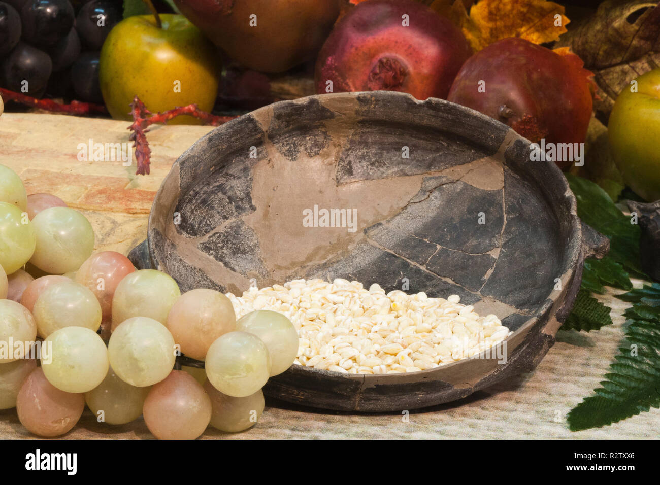 europe, italy, tuscany, vetulonia, archaeological museum, exibition, etruscan food, table laden with pots and utensils for banquet Stock Photo