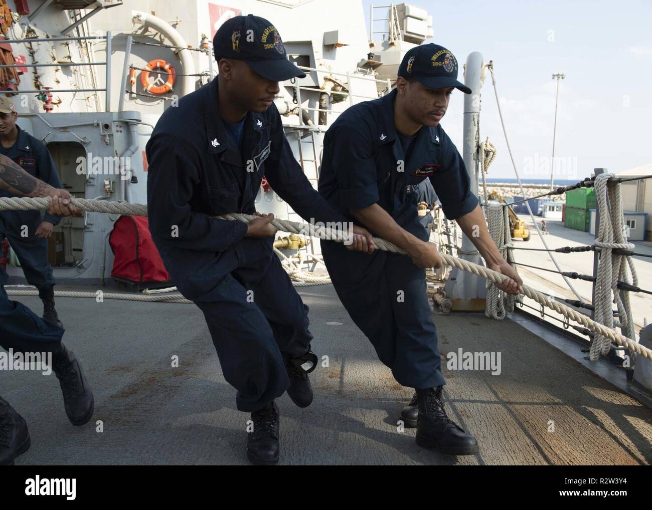 LARNACA, Cyprus (Nov. 9, 2018) Sailors heave a mooring line aboard the Arleigh Burke-class guided-missile destroyer USS Arleigh Burke (DDG 51) as the ship arrives at Larnaca, Cyprus for a scheduled port visit Nov. 9, 2018. Arleigh Burke, homeported at Naval Station Norfolk, is conducting naval operations in the U.S. 6th Fleet area of operations in support of U.S. national security interests in Europe and Africa. Stock Photo