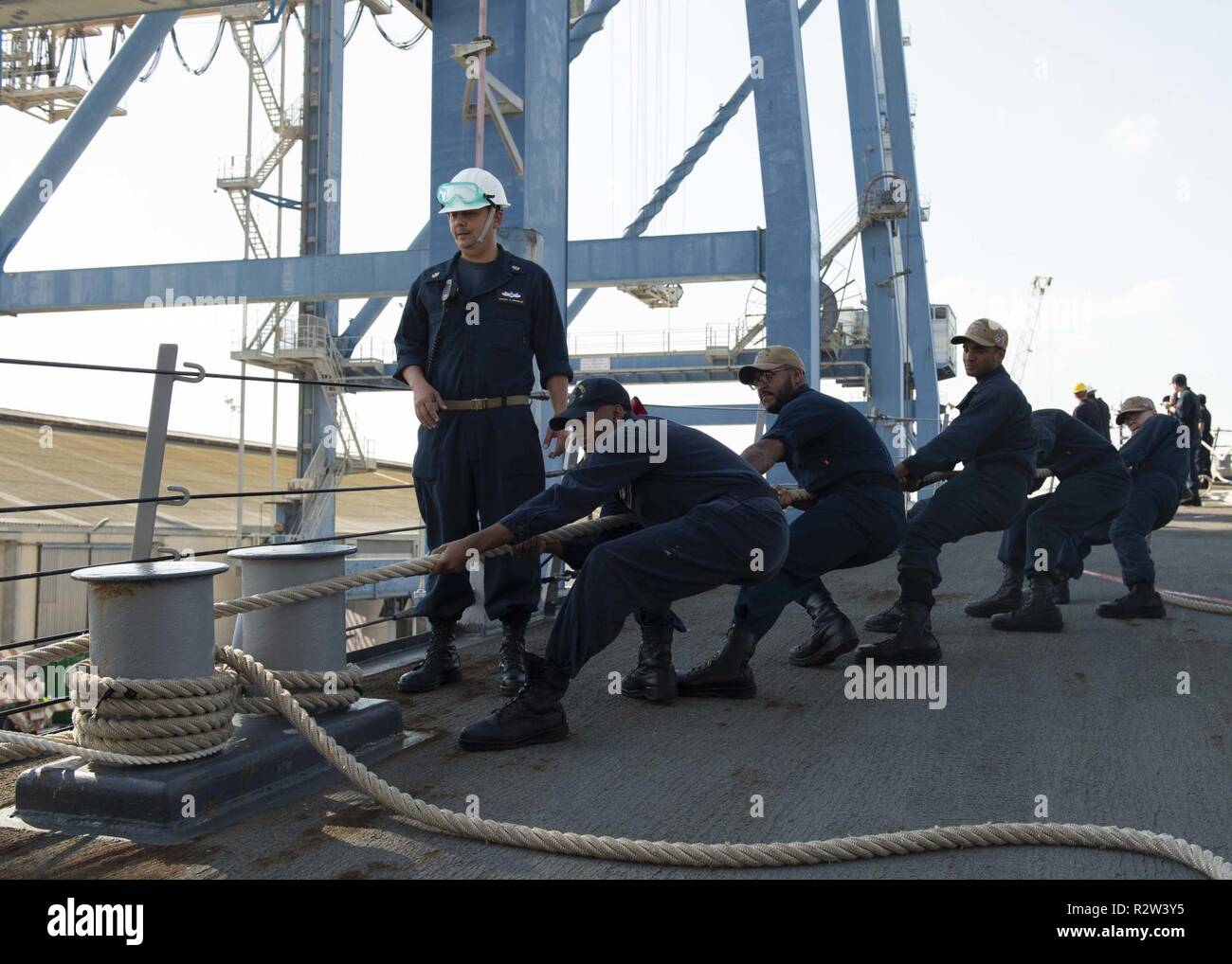 LARNACA, Cyprus (Nov. 9, 2018) Sailors place a mooring line on a bit aboard the Arleigh Burke-class guided-missile destroyer USS Arleigh Burke (DDG 51) as the ship arrives at Larnaca, Cyprus for a scheduled port visit Nov. 9, 2018. Arleigh Burke, homeported at Naval Station Norfolk, is conducting naval operations in the U.S. 6th Fleet area of operations in support of U.S. national security interests in Europe and Africa. Stock Photo