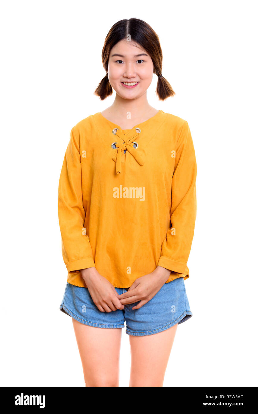 Studio shot of young happy Asian woman smiling Stock Photo - Alamy