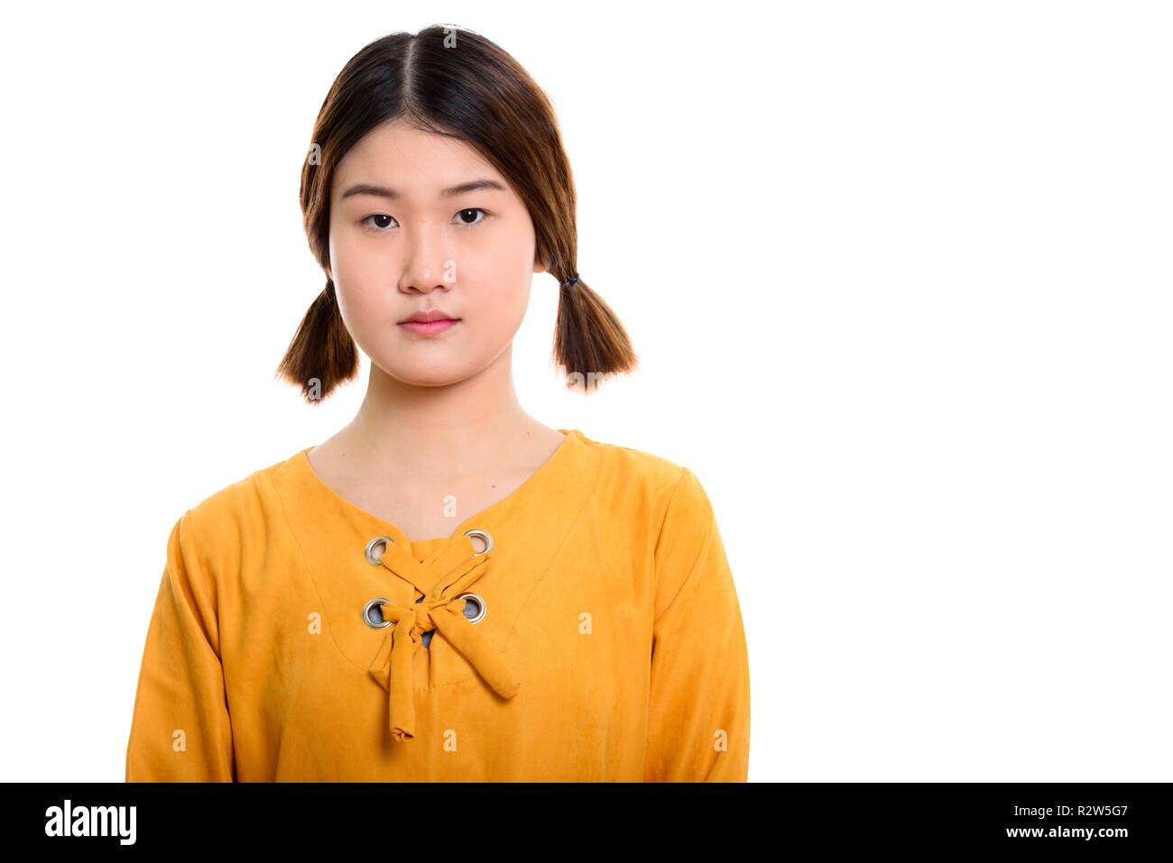 Studio shot of young beautiful Asian woman Stock Photo - Alamy