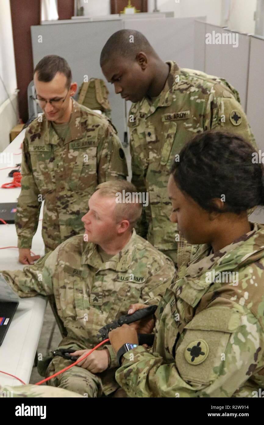 Members of the command, control, communications, and computer section of the 184th Sustainment Command set up the unit's tactical operations center for an upcoming exercise at Fort Hood, Texas. Stock Photo