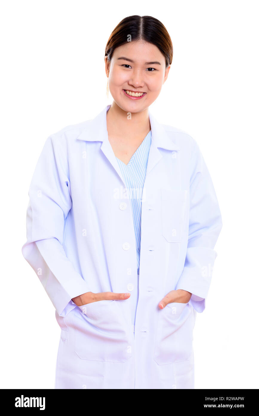 Studio shot of young happy Asian woman doctor smiling with hands Stock Photo