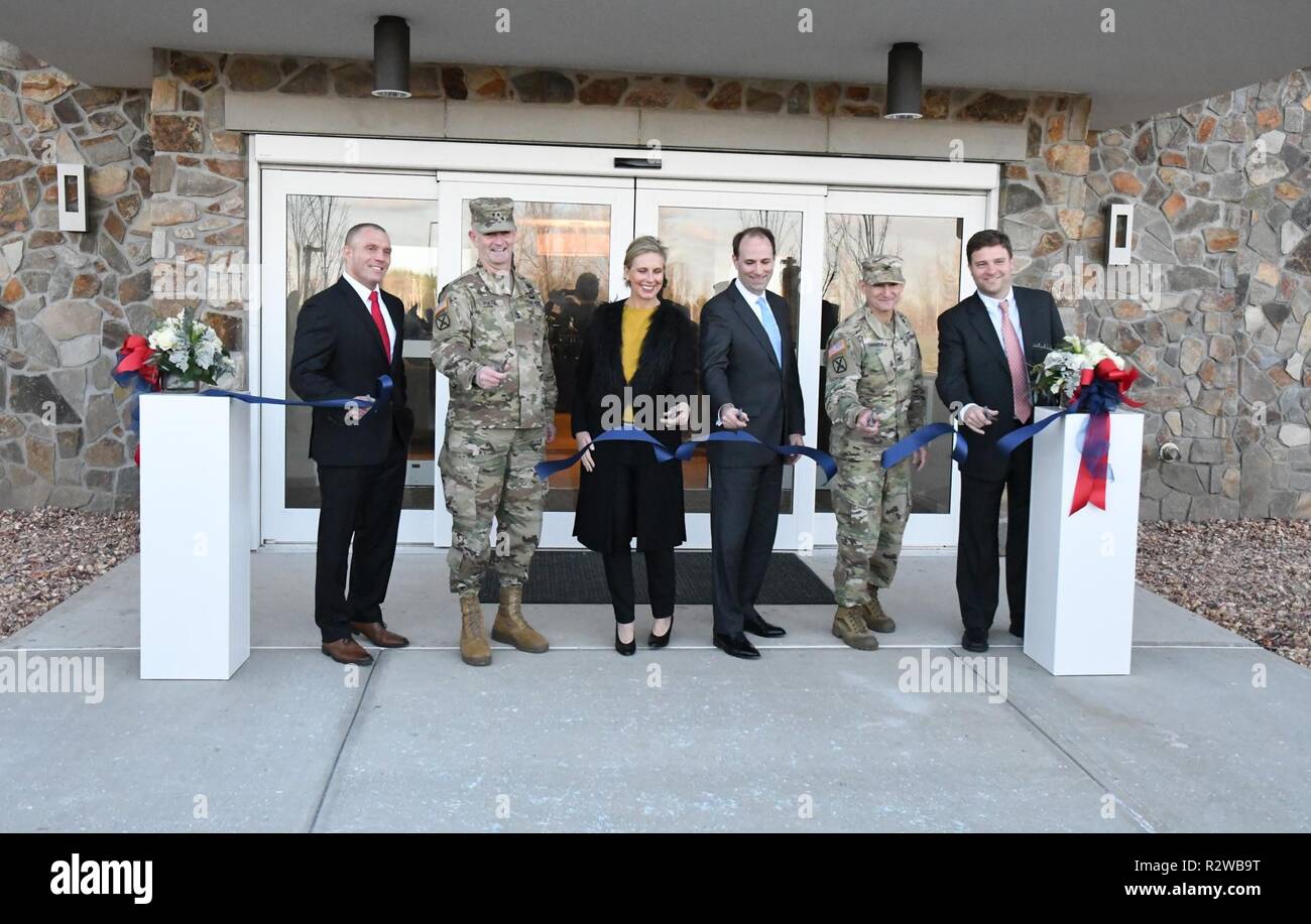 Chuck Sourbeer, IHG Army Hotels head of operations; Maj. Gen. Walter E. Piatt, 10th Mountain Division (LI) and Fort Drum commanding general; Claire Johnston, Lendlease Communities managing director; Jordan Gillis, acting assistant secretary of the Army for installations, energy and the environment; Col. Kenneth D. Harrison, Fort Drum garrison commander; and Kollin Rommel, Lendlease development manager; participate in the ribbon-cutting ceremony Nov. 14 for the grand opening of the Candlewood Suites hotel at Fort Drum. ( Stock Photo