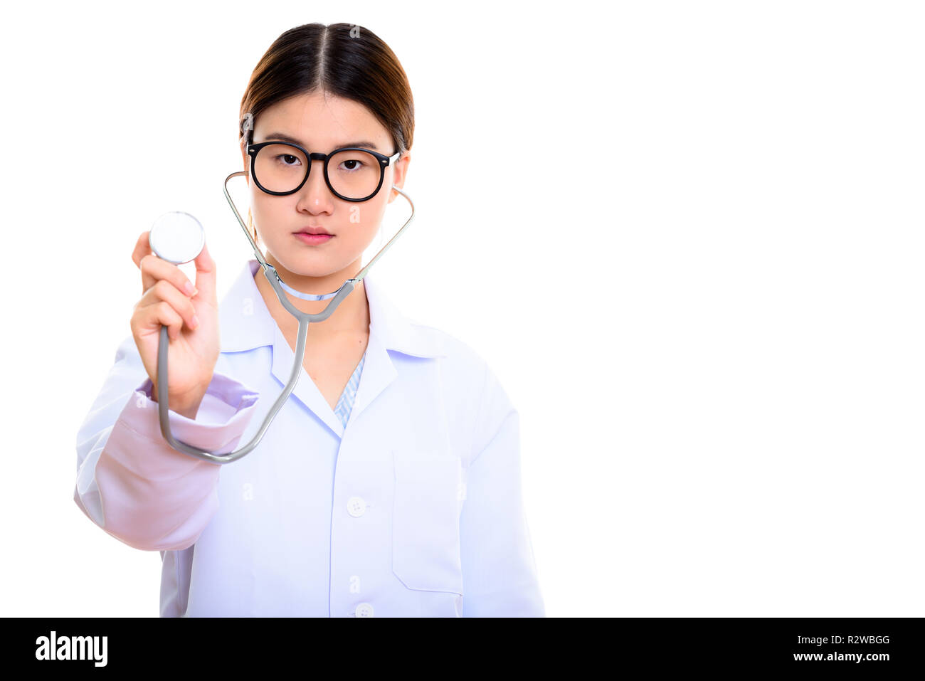 Studio shot of young beautiful Asian woman doctor using stethosc Stock ...