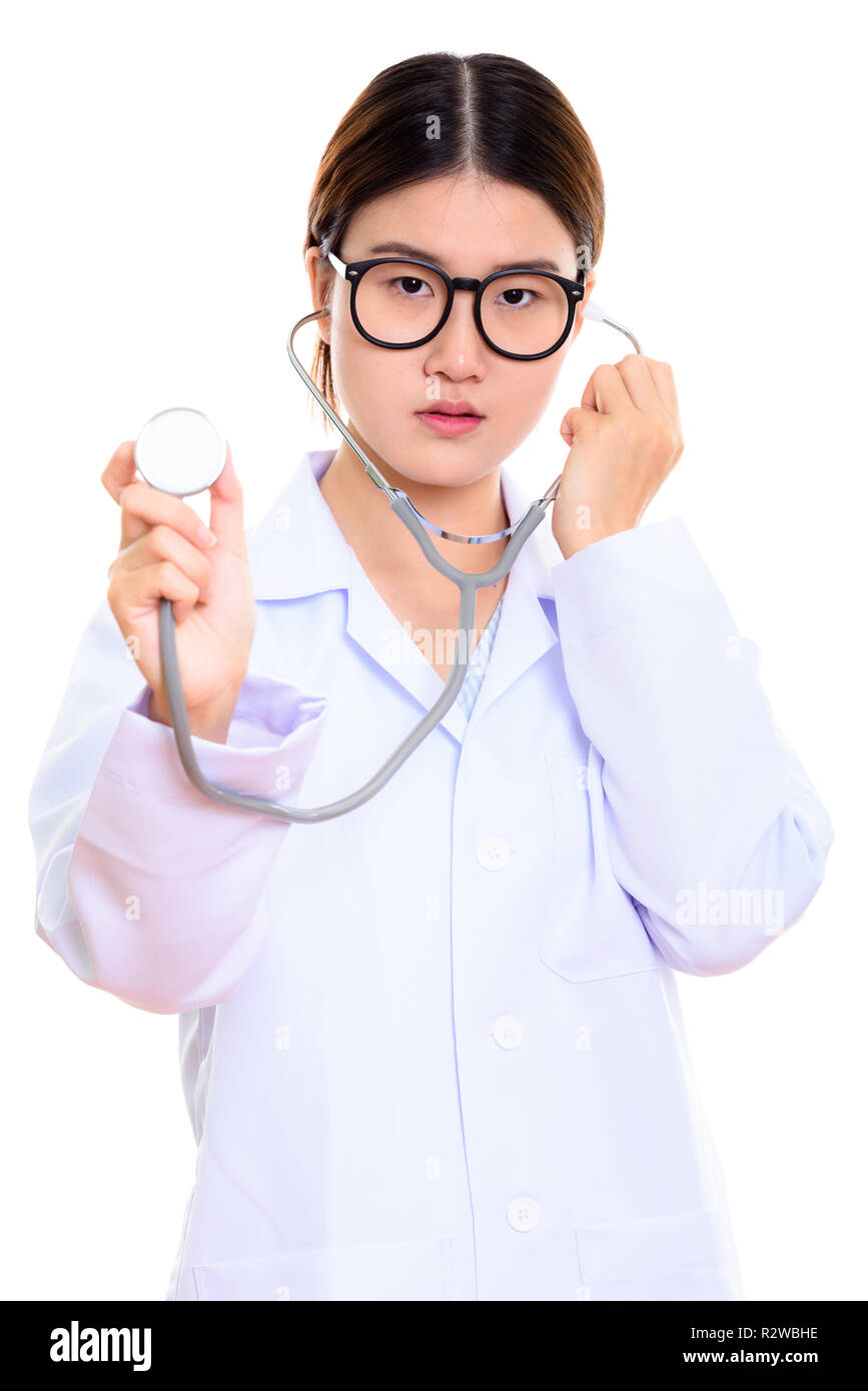 Studio shot of young beautiful Asian woman doctor using stethosc Stock ...