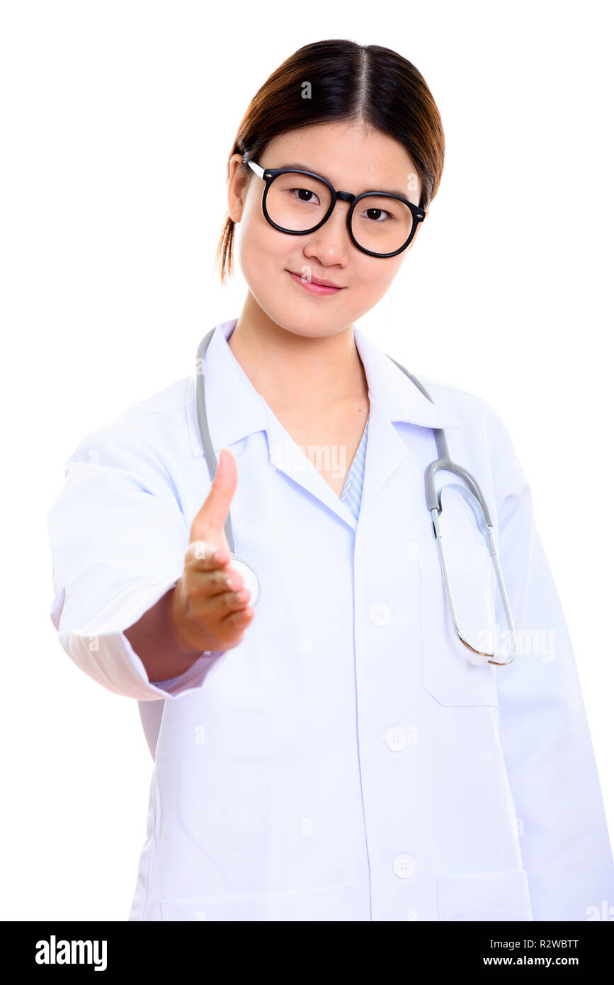 Studio shot of young beautiful Asian woman doctor giving handsha Stock ...