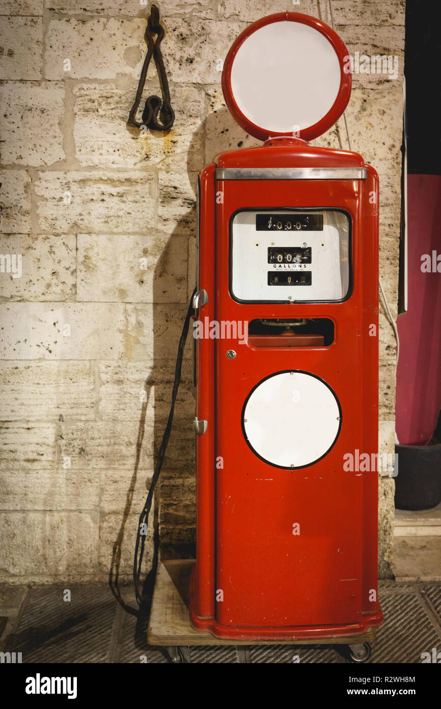 A vintage red gas station pump. Portrait format. Stock Photo