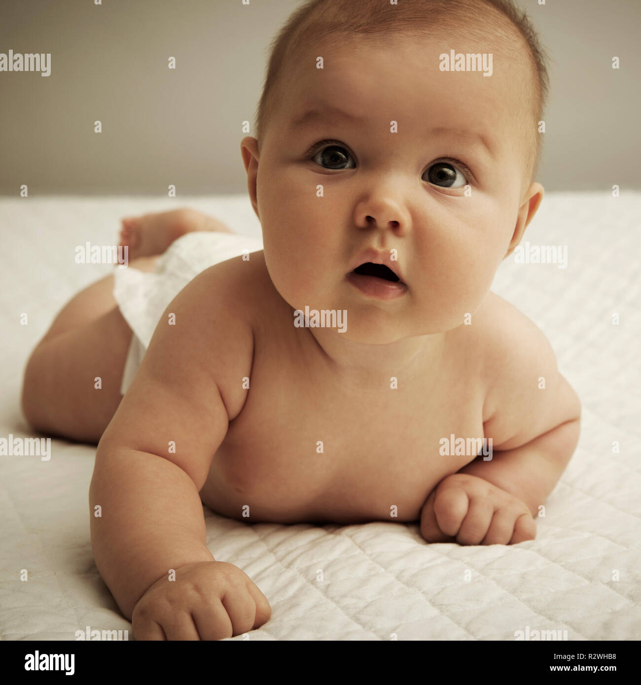 Cute baby lying on belly Stock Photo