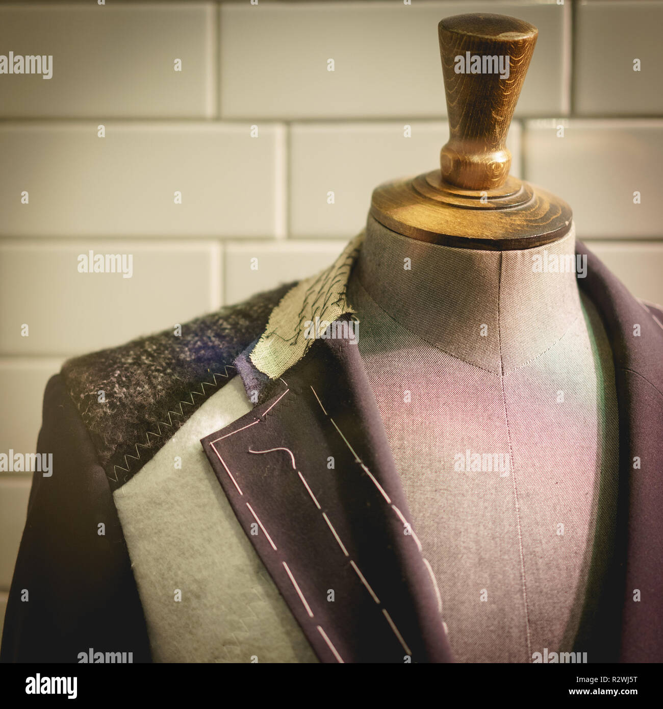 Detail of a clothing mannequin in a men suit shop with a white