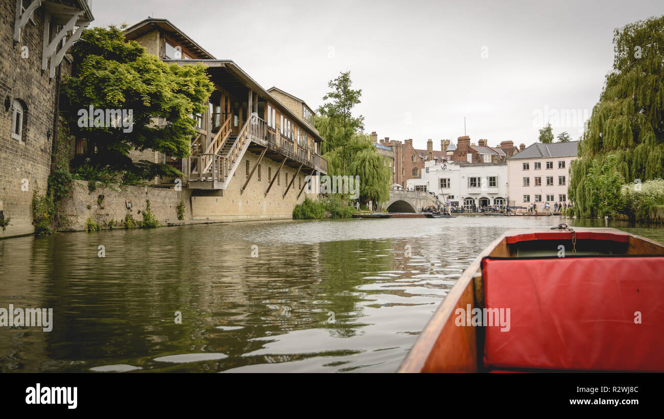 Cambridge, UK - February, 2019. Tourist on a punt sightseeing trip on the river Cam through the back of various colleges. Stock Photo