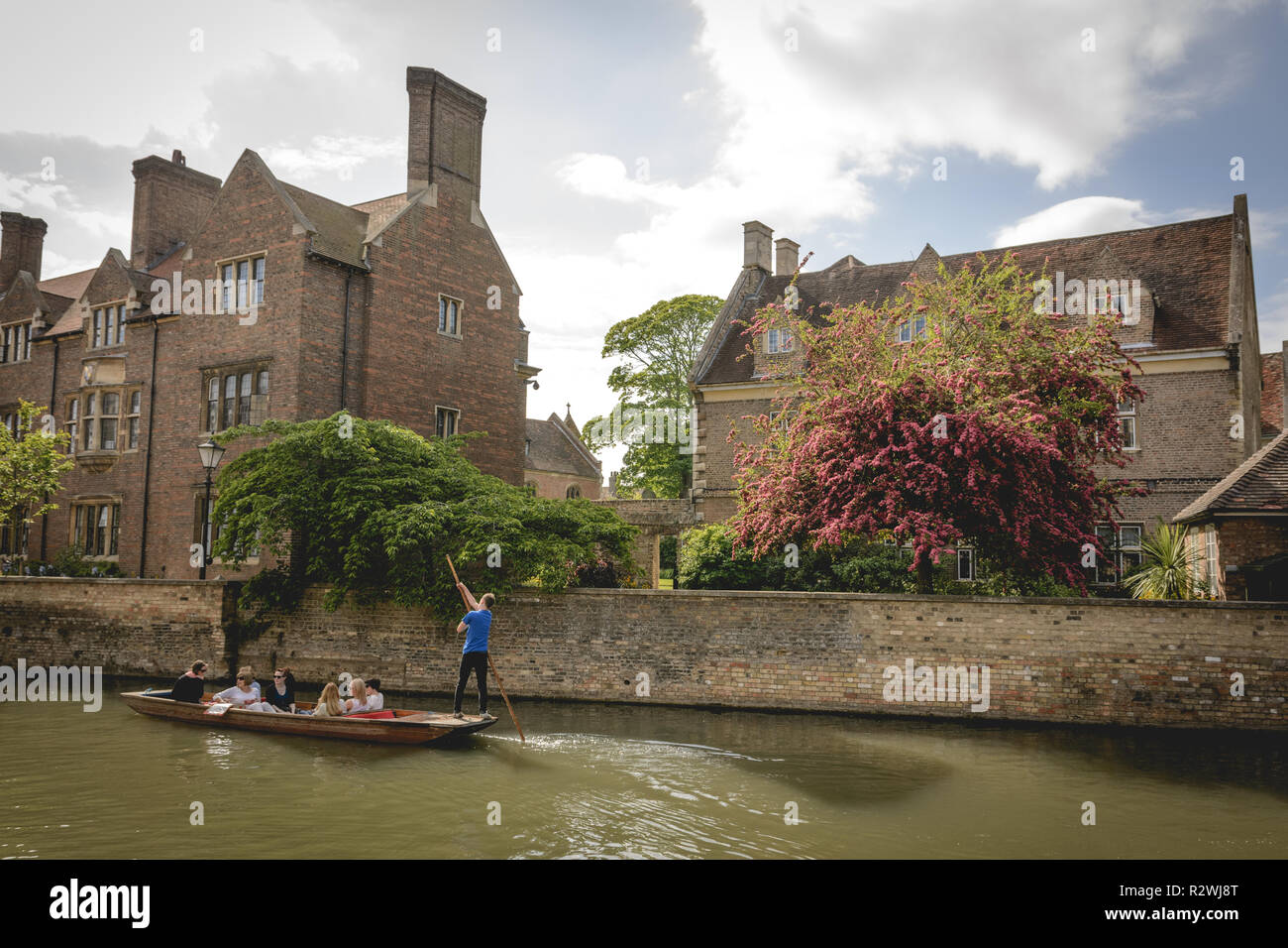 Cambridge, UK - February, 2019. Tourist on a punt sightseeing trip on the river Cam through the back of various colleges. Stock Photo