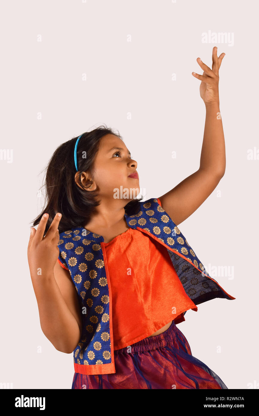 Little girl dancing in front of camera on white backdrop, Pune, Maharashtra  Stock Photo - Alamy