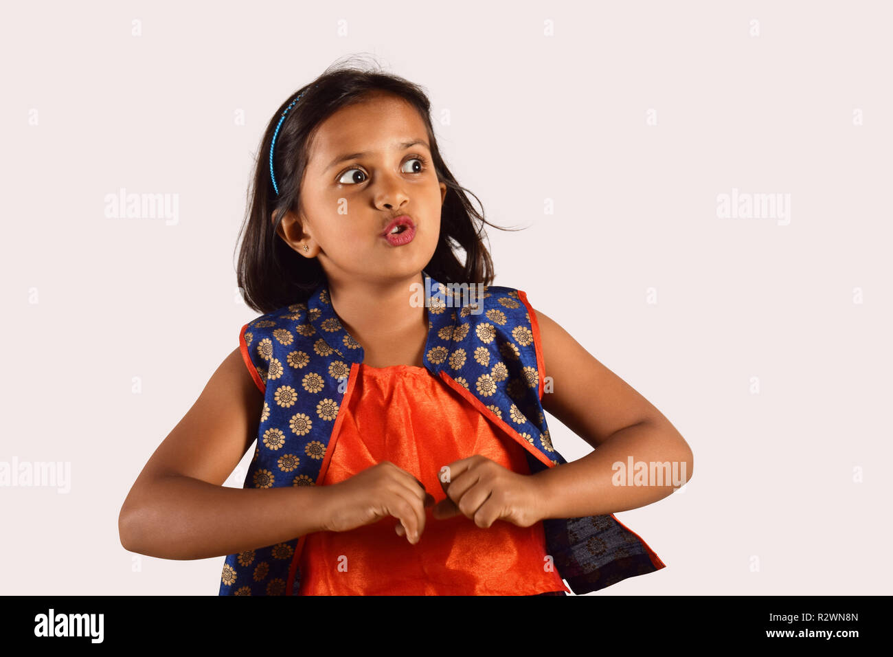 Pretty little girl looking excited, Pune, Maharashtra Stock Photo