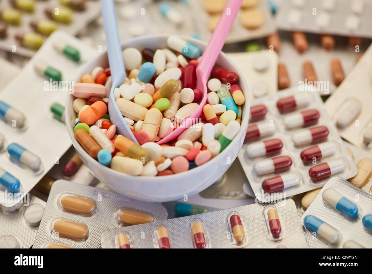 Drug abuse concept with many tablets and pills in a bowl Stock Photo
