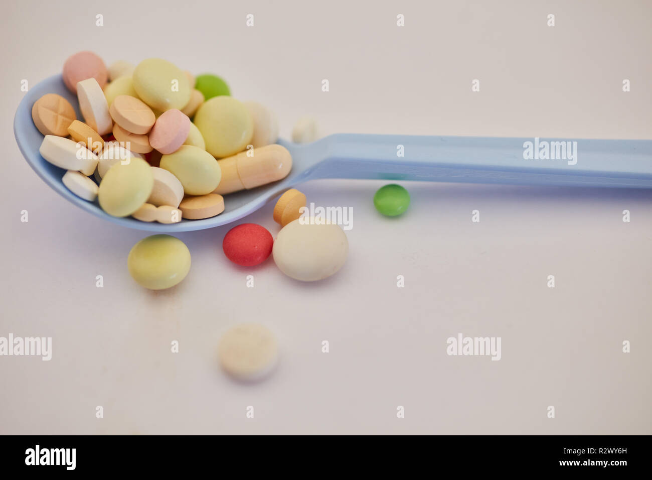 Full spoon with tablets and pills as a drug abuse concept Stock Photo