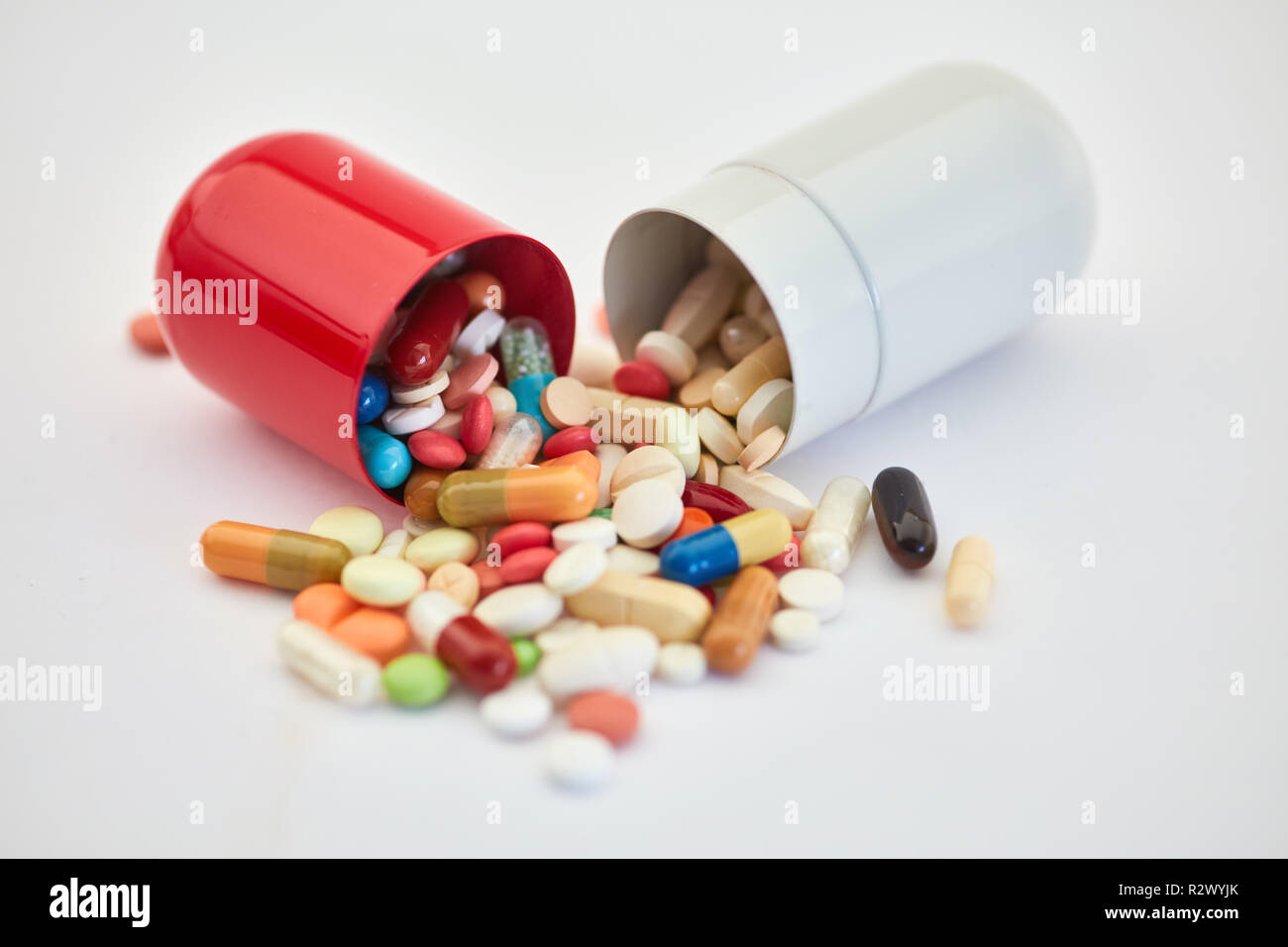 Large open capsule with many medications and pills inside Stock Photo Alamy