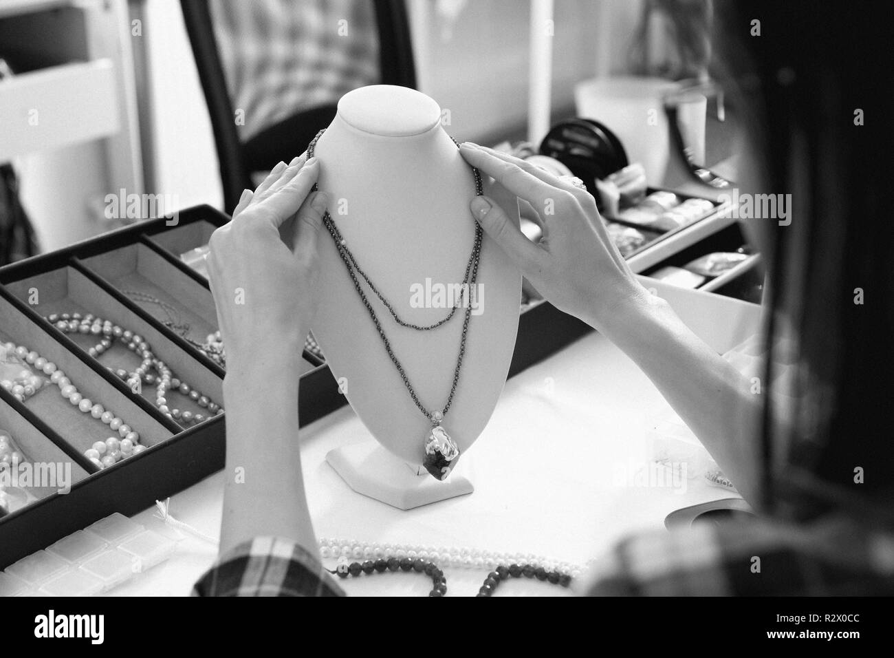 Jeweler at work, crafting in a jewelry workshop. Stock Photo