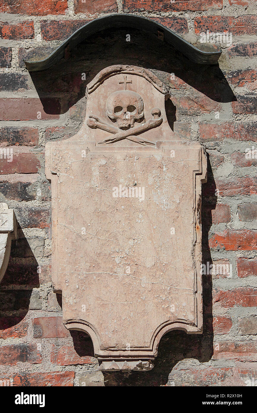 Mounted burial headstones based upon the outside wall of the Frauenkirche in Munich Germany Stock Photo
