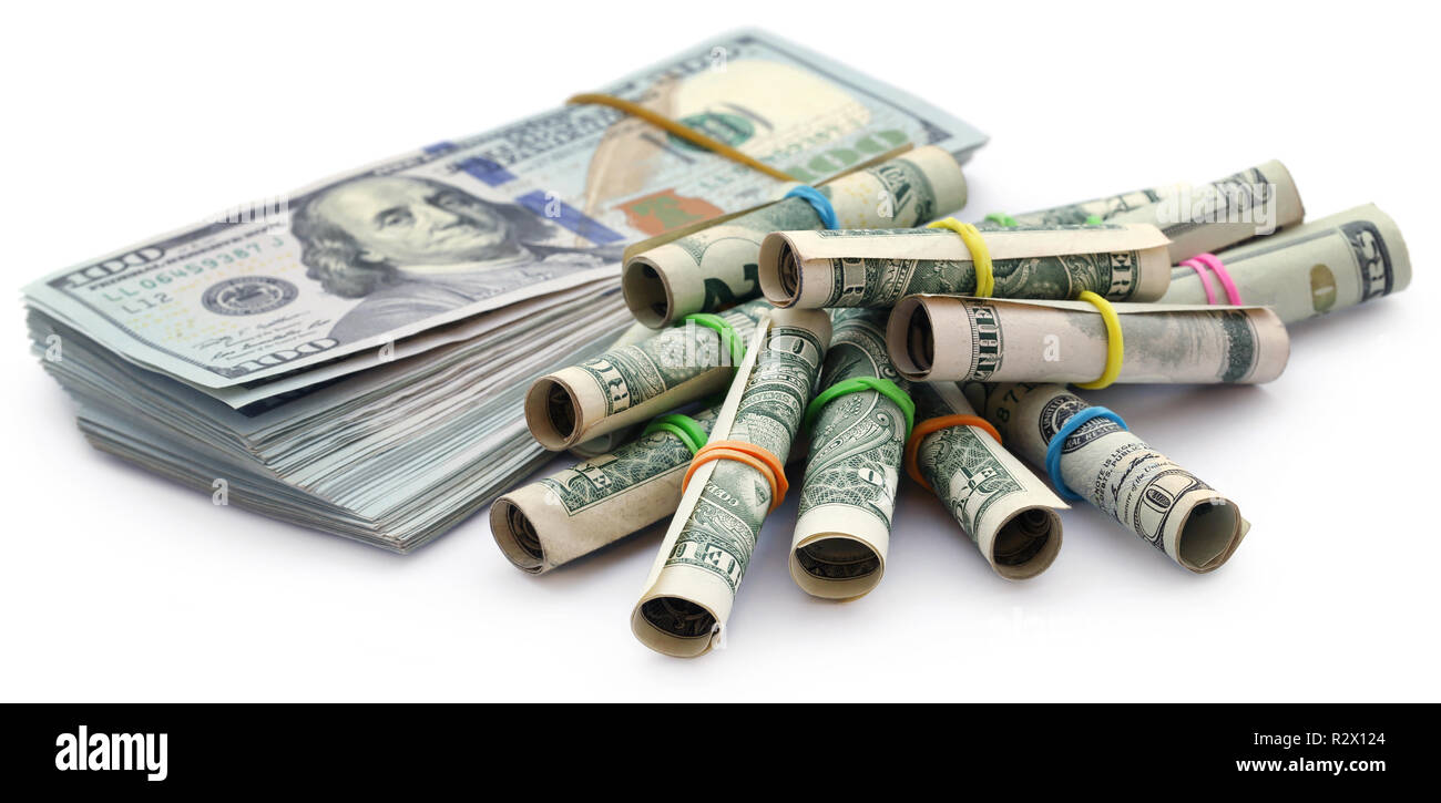 Rolled US Dollar wih a bundle of 100 over white background Stock Photo