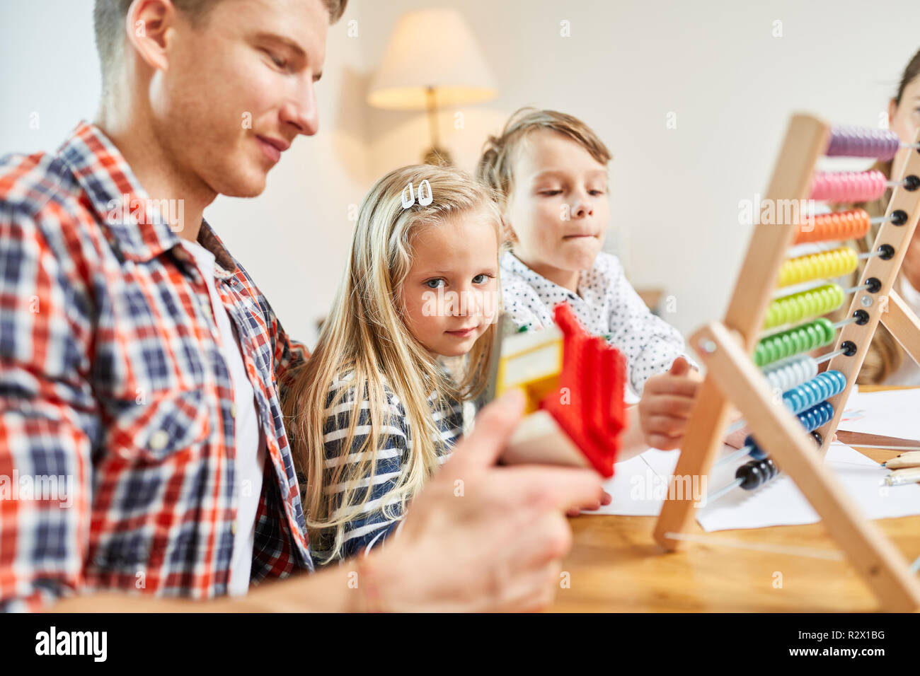 Father and children dream of the house as a home and plan the financing Stock Photo