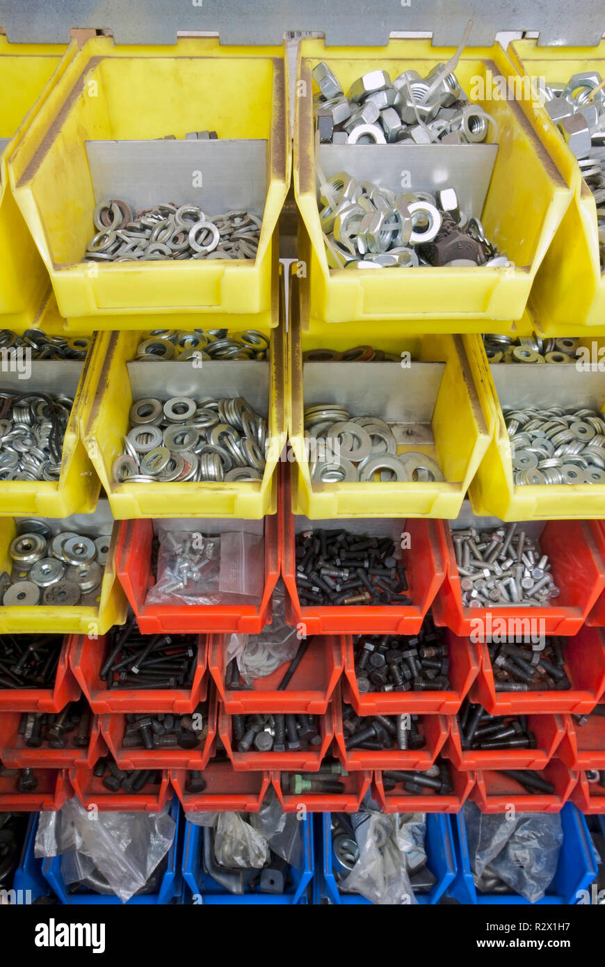 screws and nuts in colored boxes Stock Photo Alamy