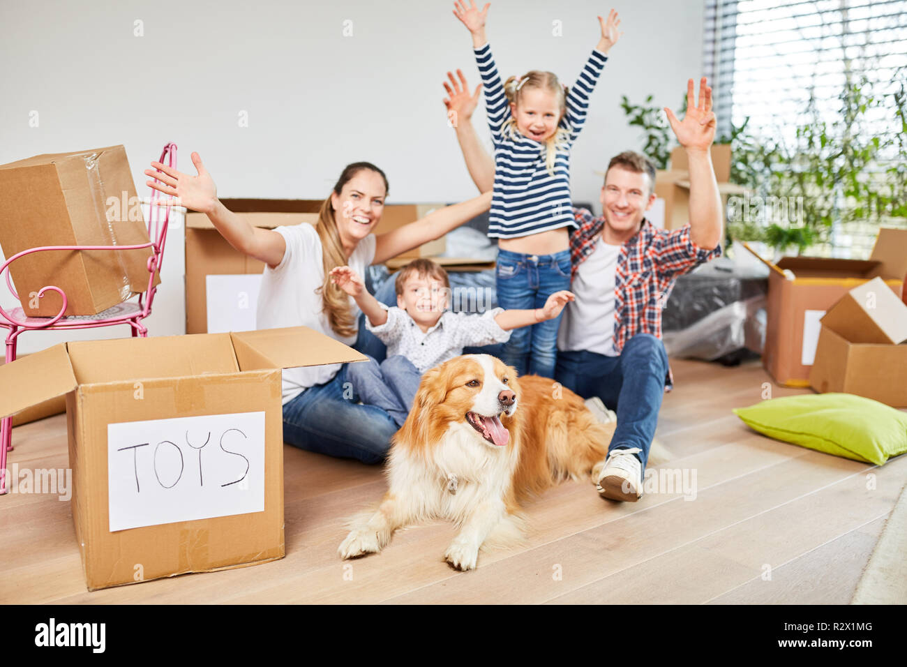 Children and parents rejoice over the new condominium or home Stock Photo