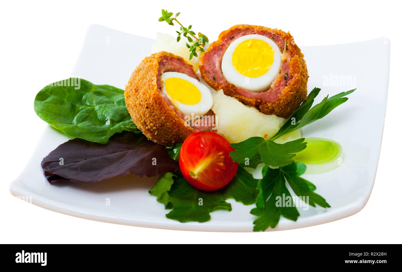 Hardboiled quail egg wrapped in minced meat, breaded and fried