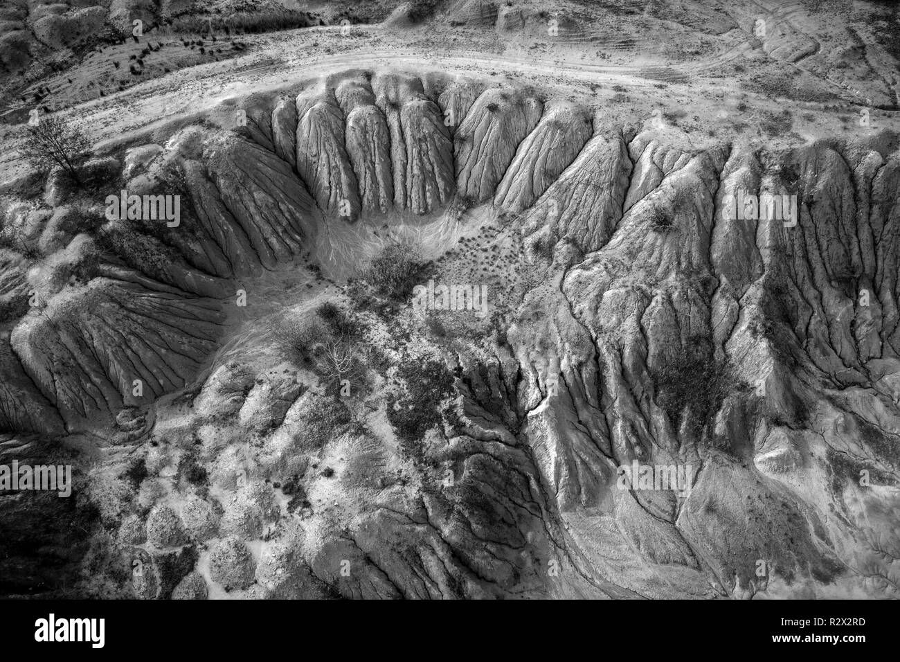 Black and white image of abandoned industrial exploitation, opencast mine. Aerial drone view Stock Photo