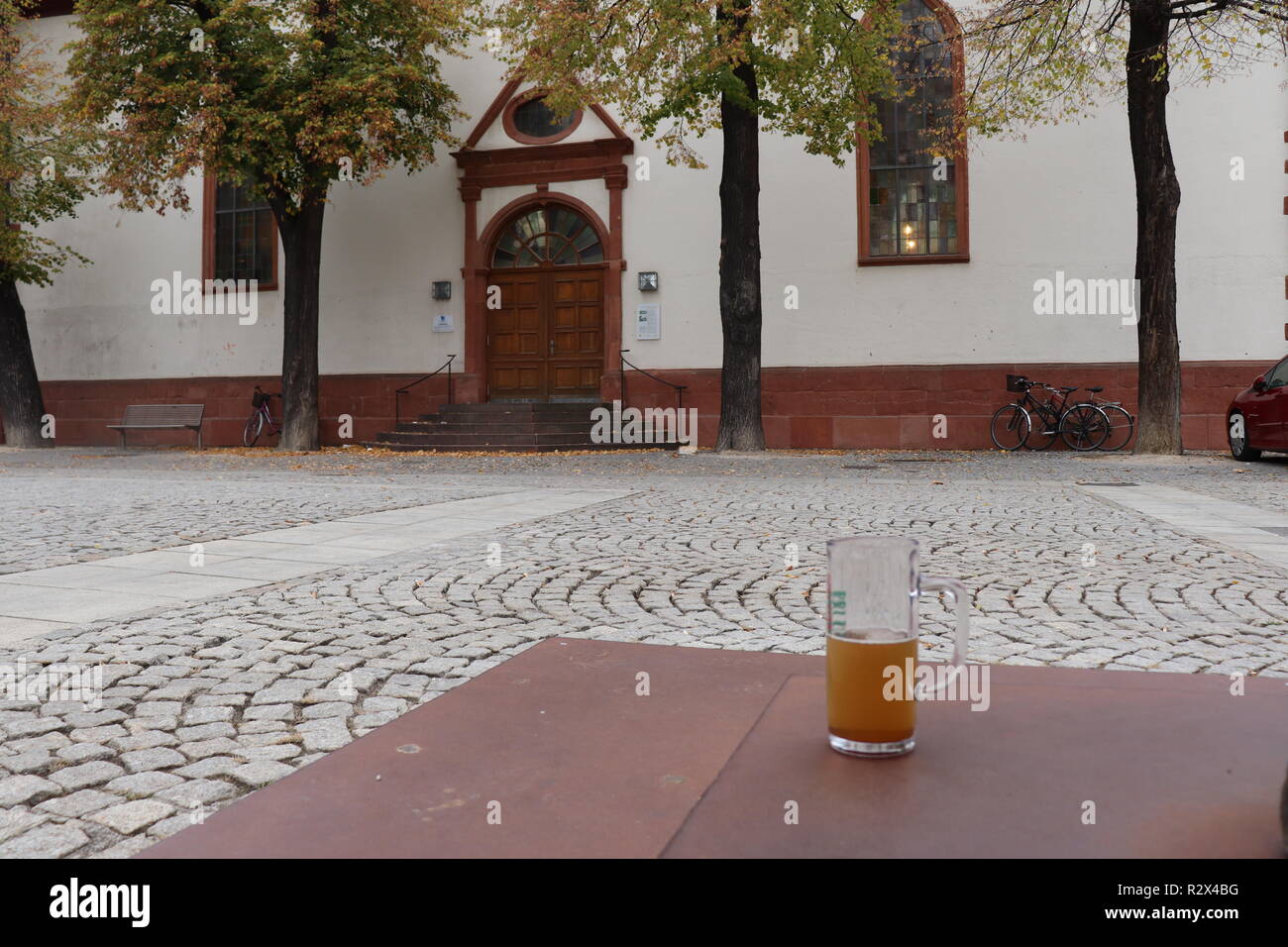 A glass of beer outside a church on Sunday morning during the service