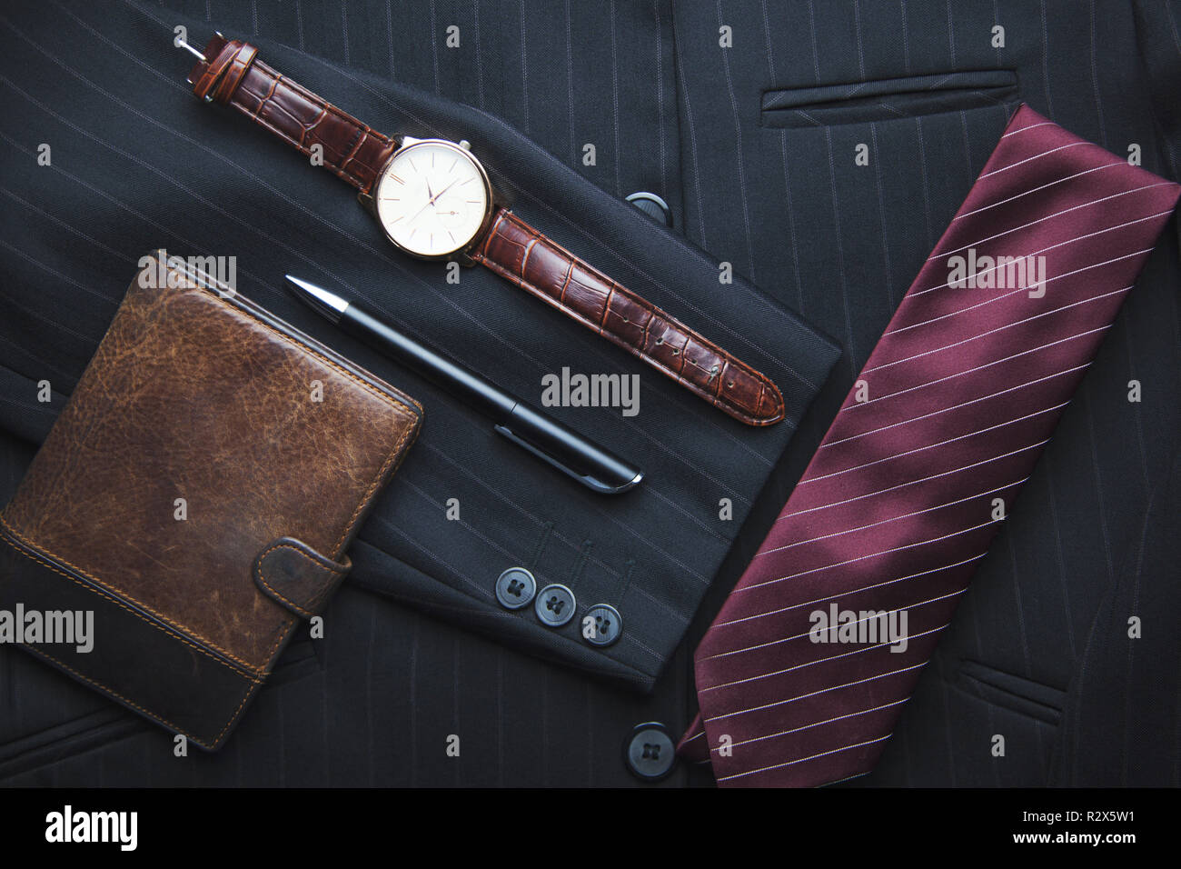 Men's wallet, watch, tie on suit Stock Photo