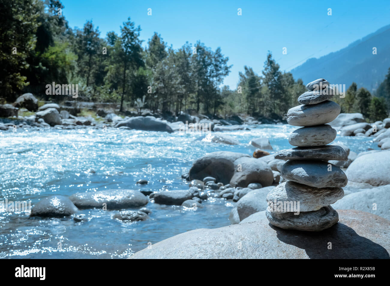 Heap of white stone stack of rock decoration in vertical style composition, copy space. Harmony, stability, strength, well being, concept. Useful in h Stock Photo