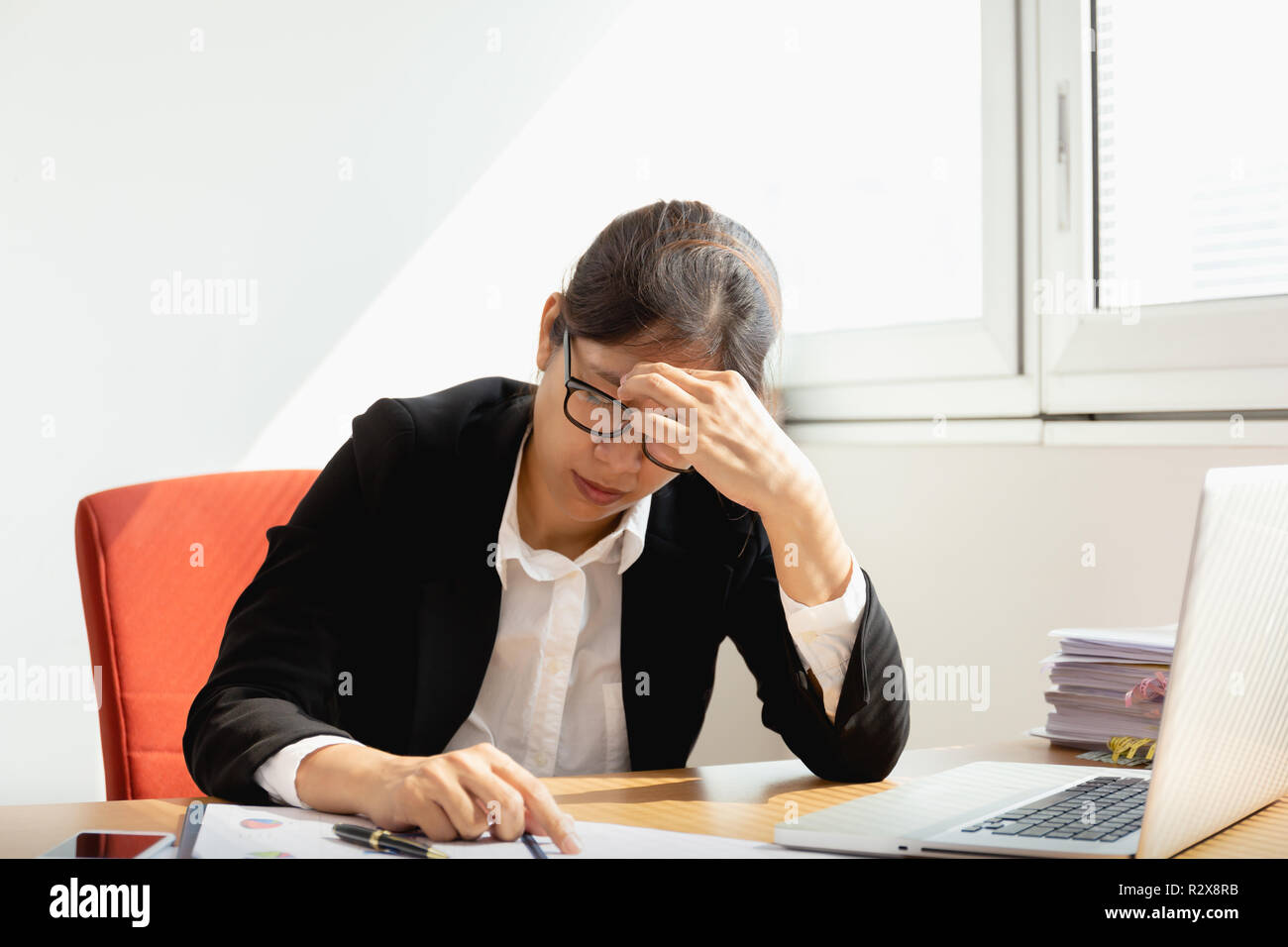 Woman head in hands sad computer hi-res stock photography and images ...