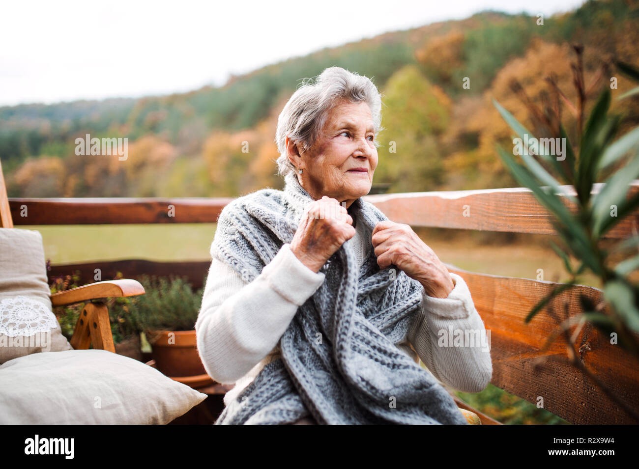 Elderly lady sitting in a chair hi-res stock photography and images - Alamy