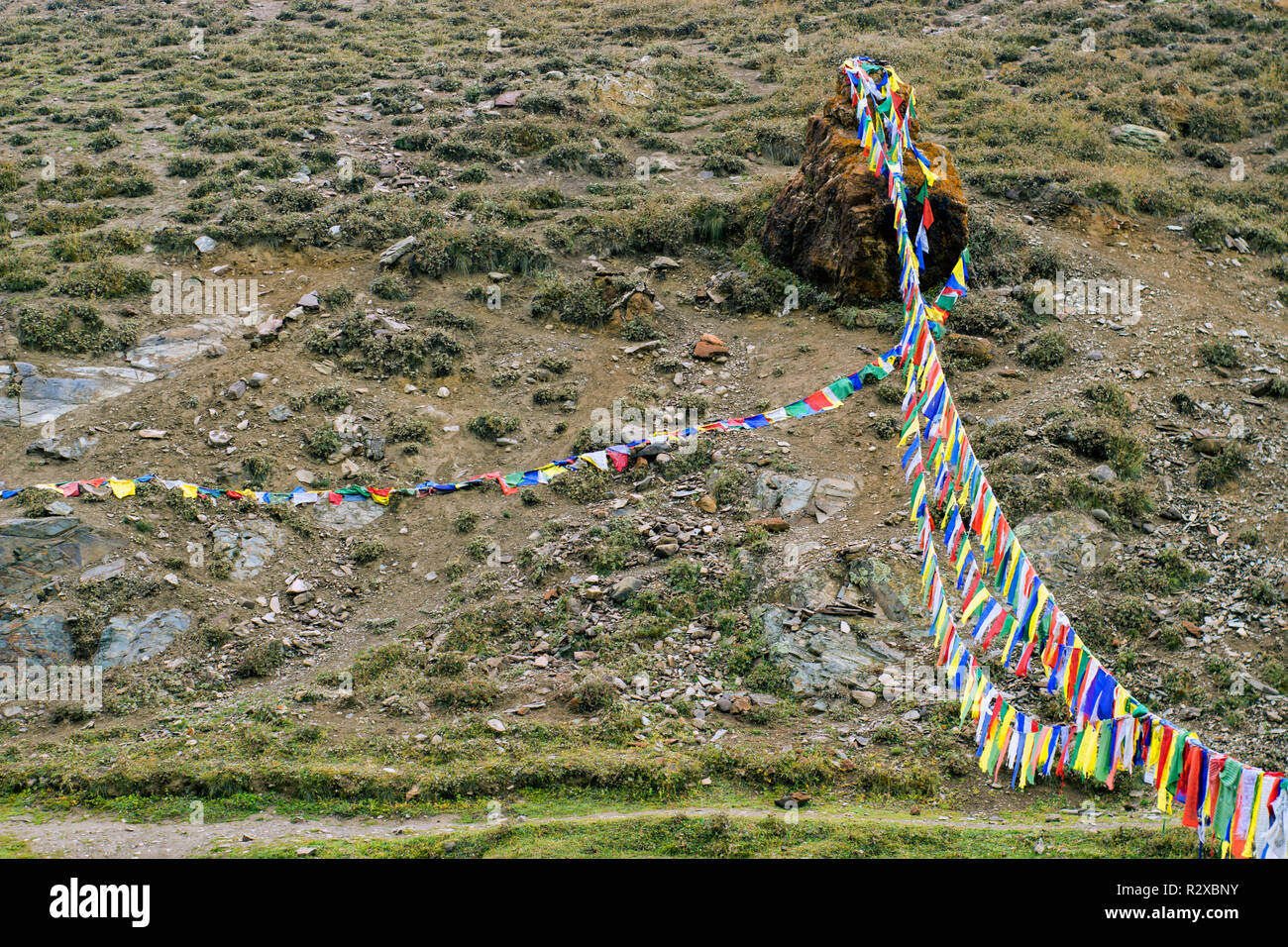 Tibetan colorfull flags fluttering in the wind in the Himalayas. Buddhism concept. Stock Photo