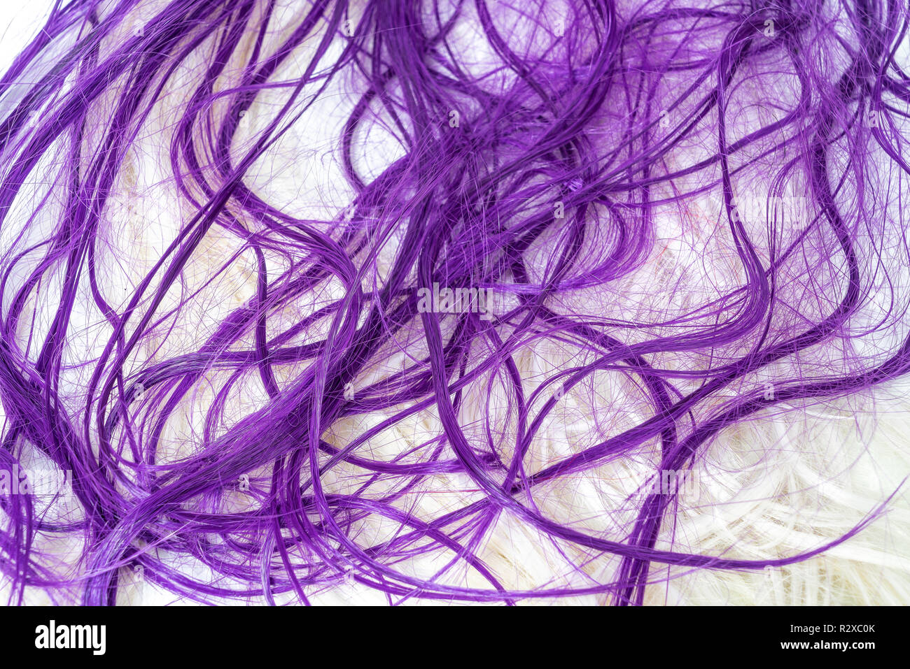 long colored hair on a white surface Stock Photo