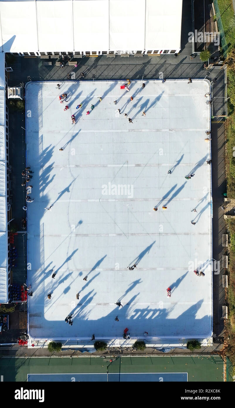Aerial View Of People Ice Skating On An Outdoor Ice Rink Stock
