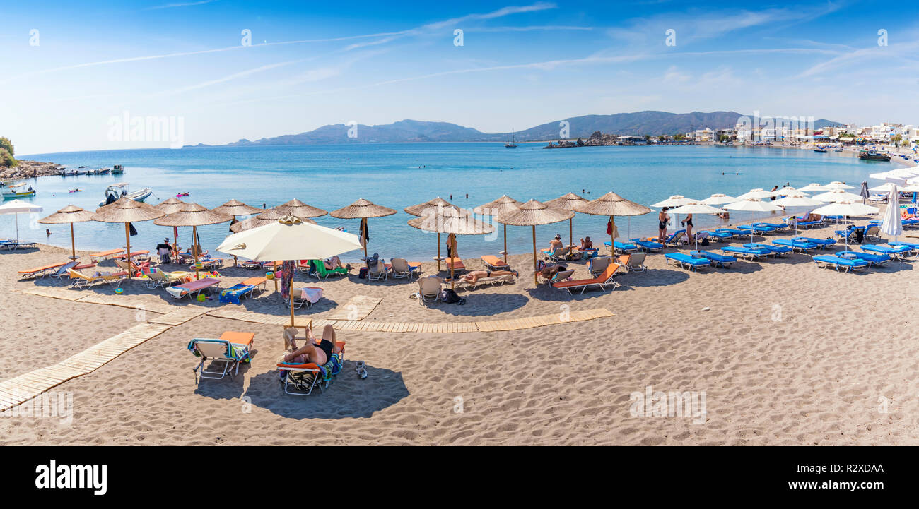 Panoramatic view of Haraki beach and holiday-makers (Rhodes, Greece) Stock Photo
